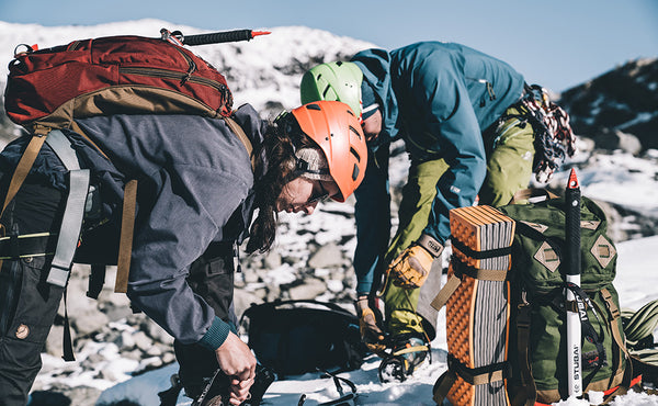 A person preparing to ice hiking with a Guide's Edition Synapse 25.